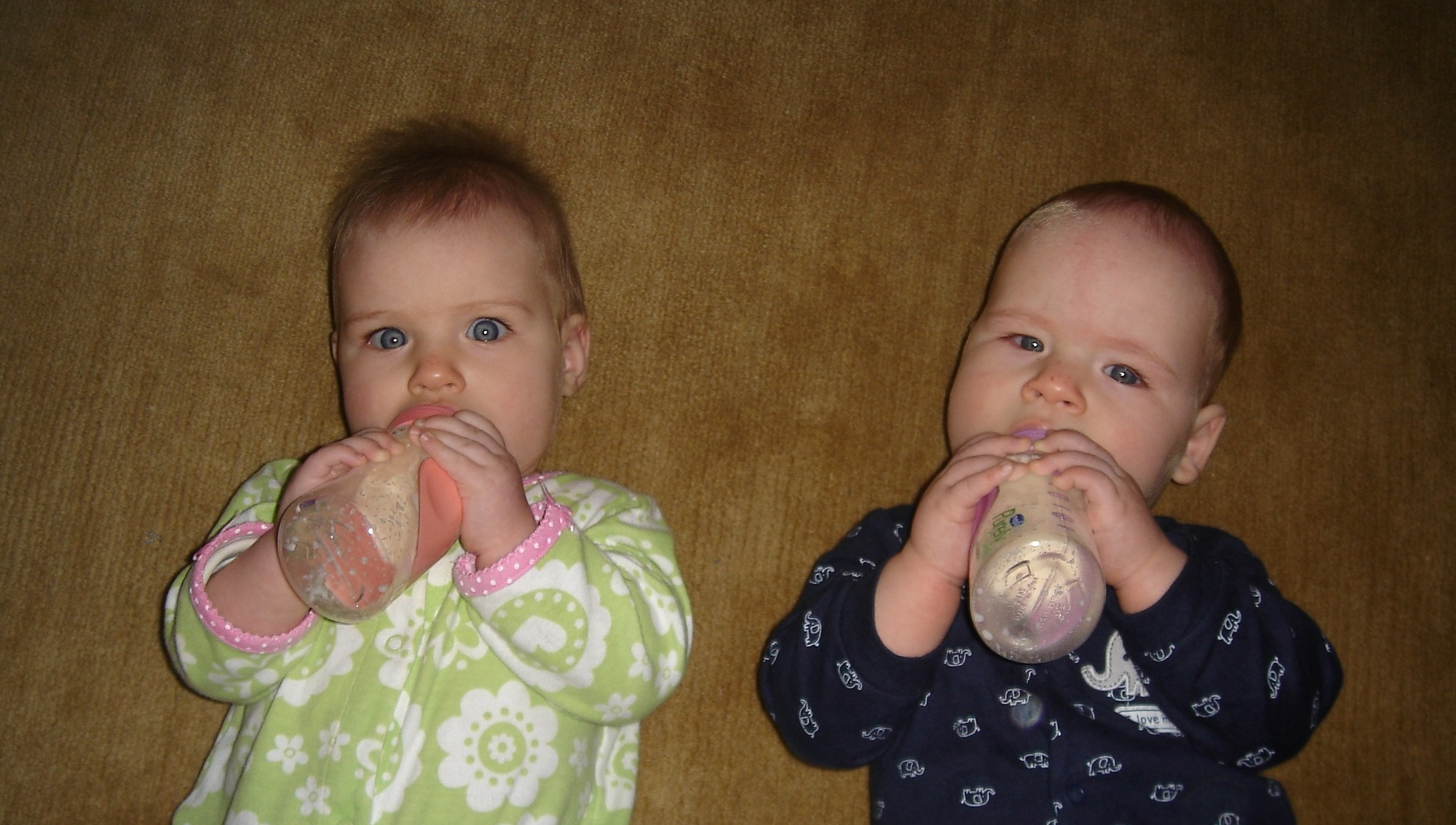 Twins drinking bottles